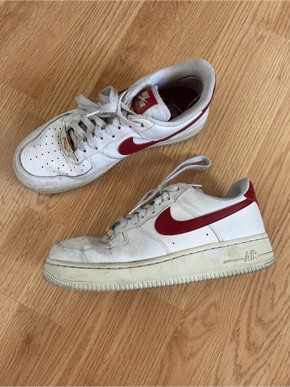 Nike White Sneakers with Red Swoosh Accents